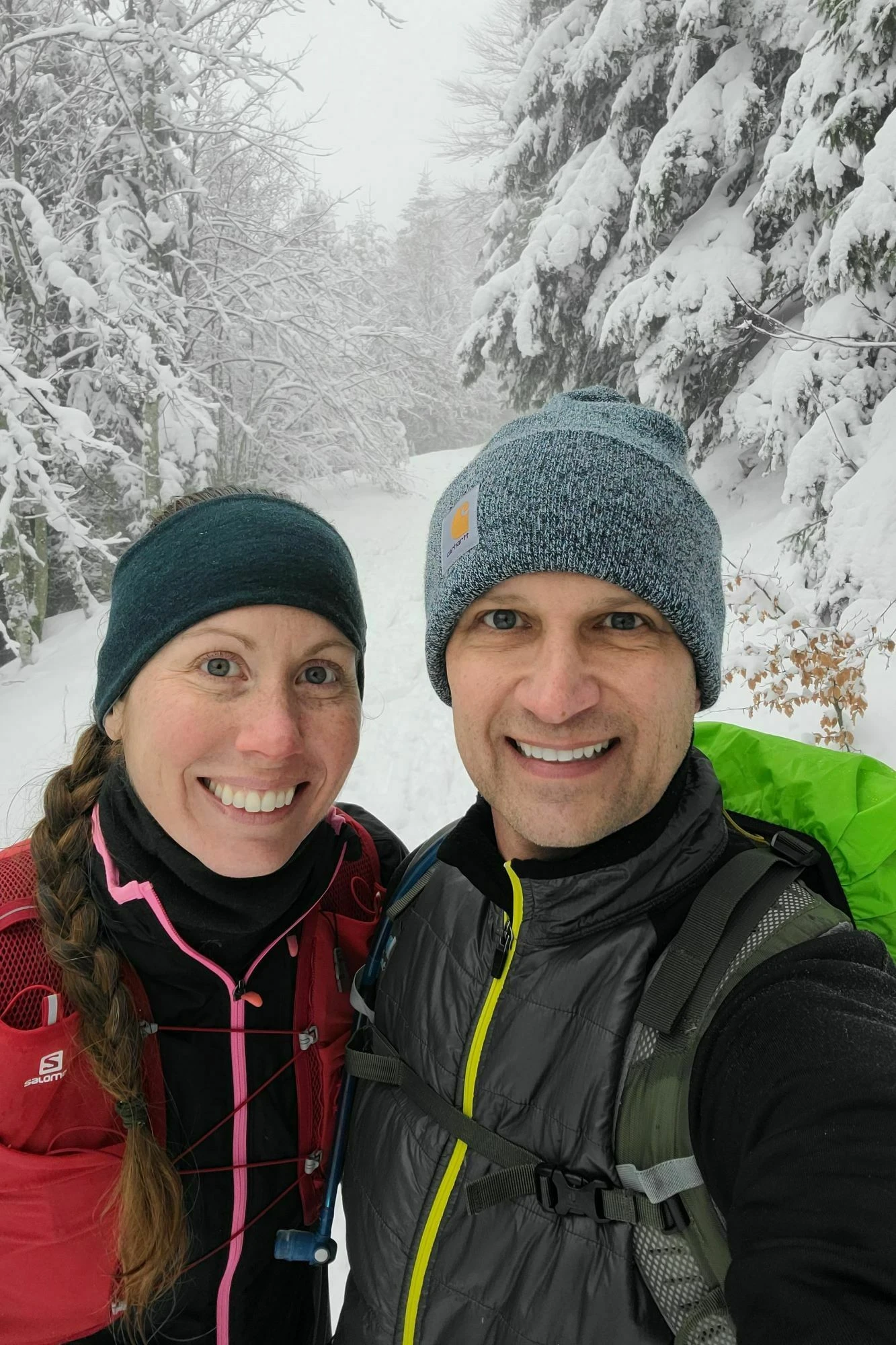Ashley and Andrew on a snowy forest trail in the Alsace Vosges mountains near Metzeral