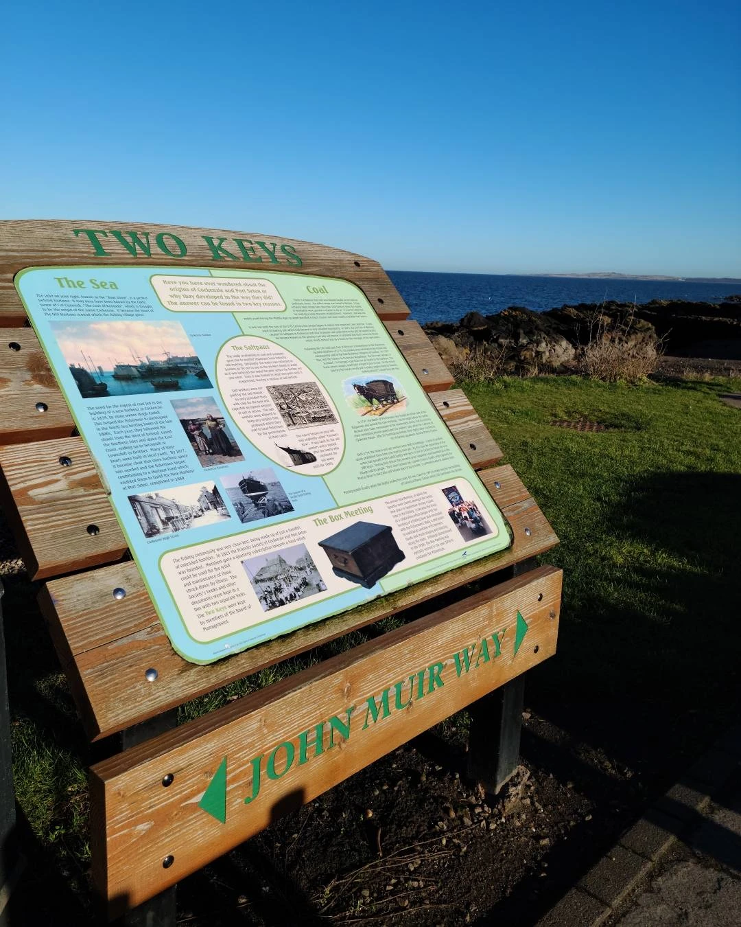 John Muir Way information board at Cockenzie with the Scottish coastline in the background